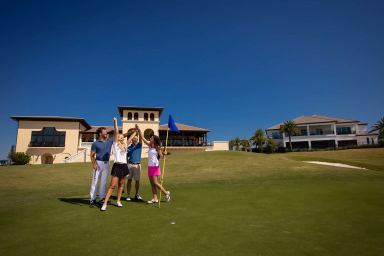 Group Of 4 Golfers Cheering On The Jack Nicklaus Golf Course.