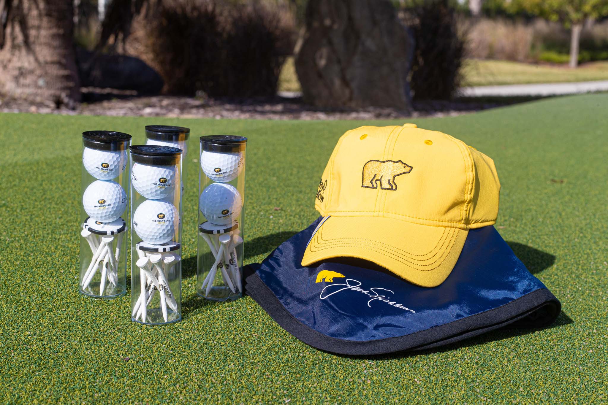 Golf Gift Package Items: A Bear’s Den Hat, Golf Balls Ans Tees, And A Jack Nicklaus Bag At Bear's Den Resort Orlando.