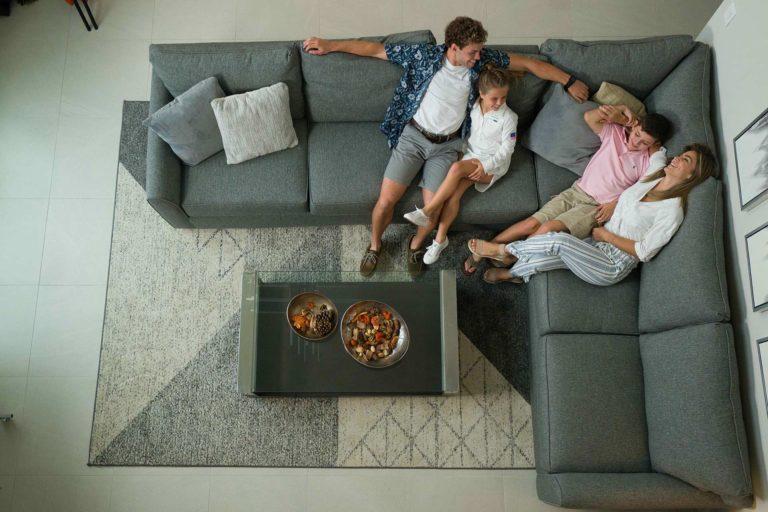 Family relaxing on a sectional couch