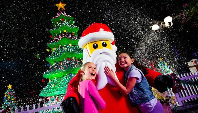 Girls hugging lego Santa at Legoland Orlando