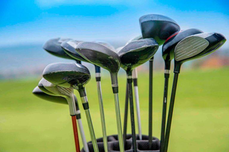 Set of golf clubs in a bag on a green