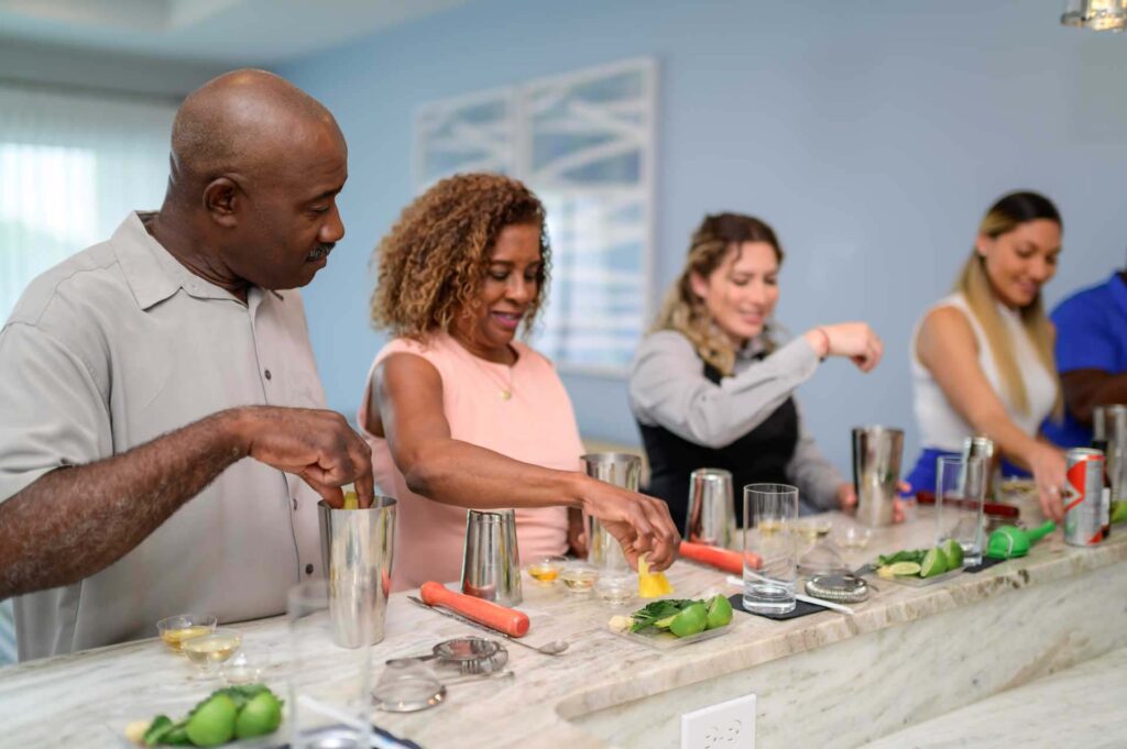 Group mixing cocktails in their Bear's Den Resort home for the Bartender experience
