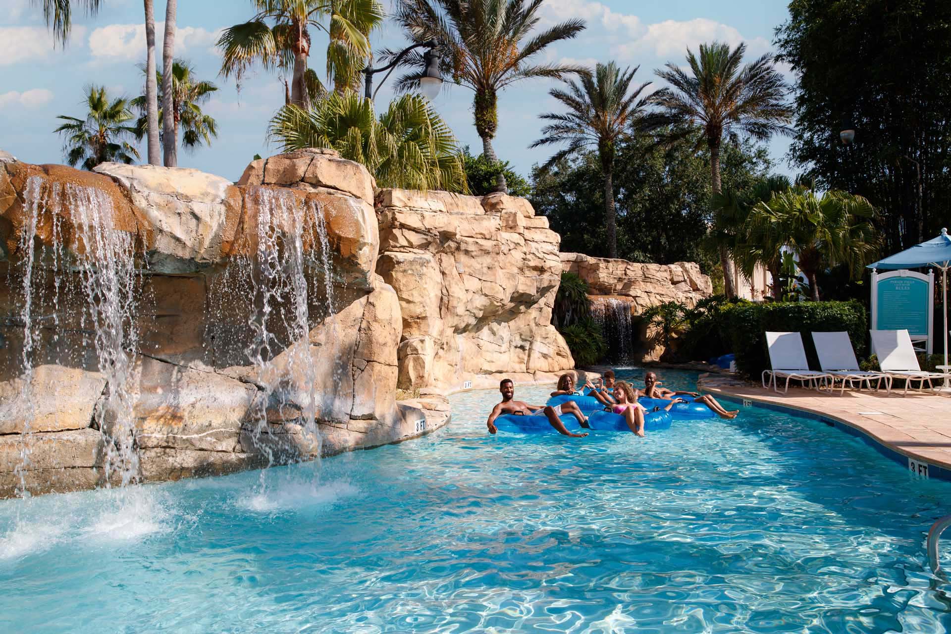 Unlock VIP Resort Perks: Why Direct Booking at The Bear’s Den Outshines Expedia 2 Families enjoying the lazy river at the Reunion Resort Water Park