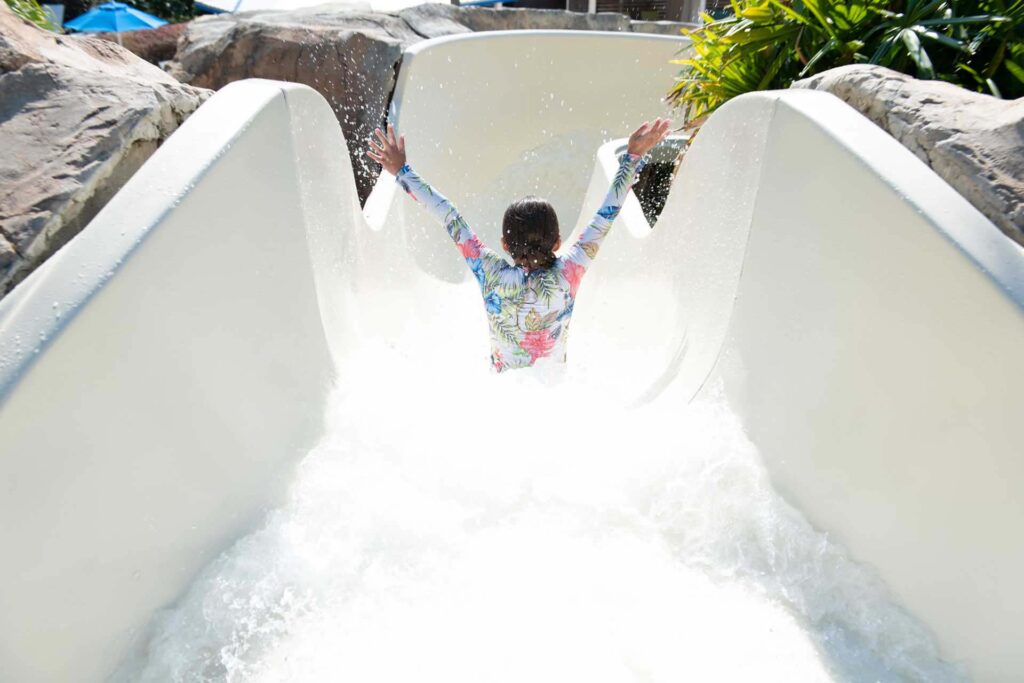 Water Park 2 Young girl going down the water slide at the Reunion Resort Water Park