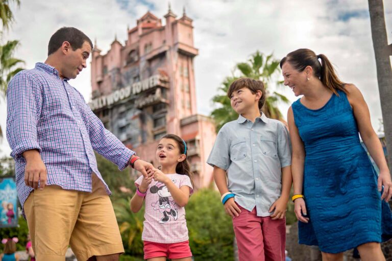 Family walking in front of the Tower of Terror in Disney's Hollywood Studios | Walt Disney World