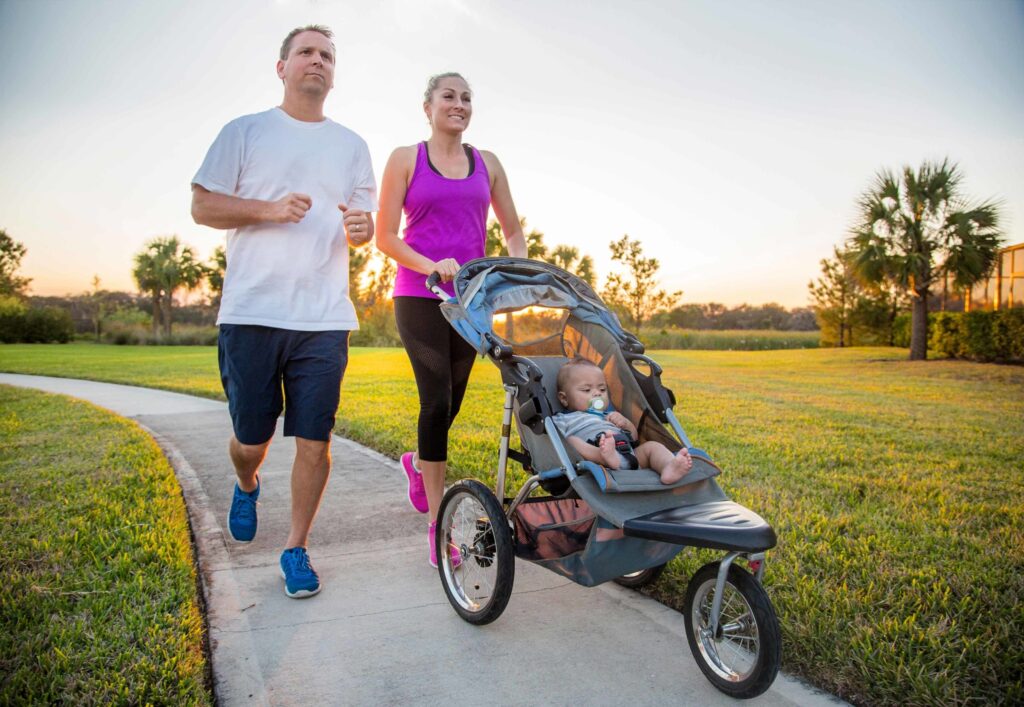 spectrum couple jogging pushing stroller