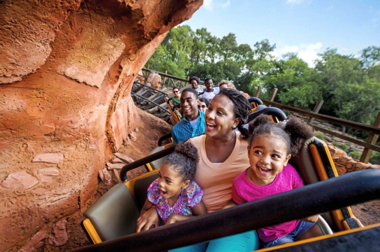 Mother and daughters riding on the Thunder Mountain Railroad at the Magic Kingdom in Walt Disney World