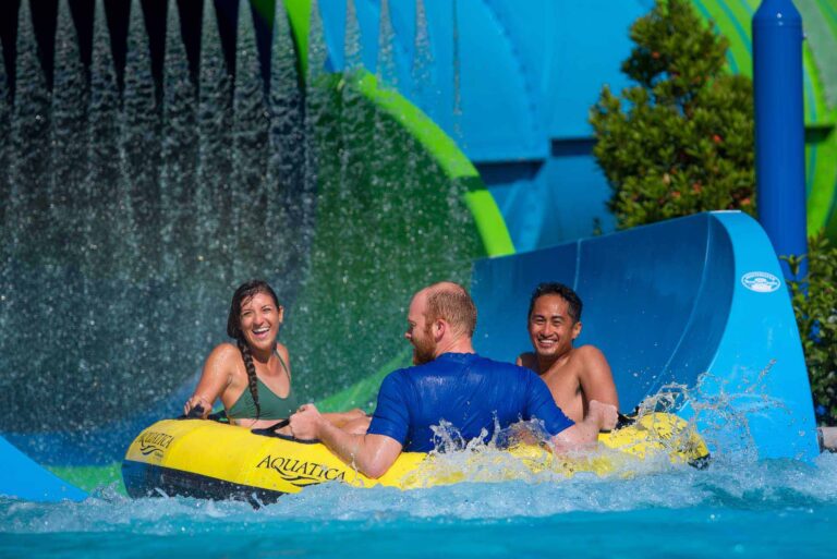 Group of friends in a raft on the Ray Rush waterslide at Aquatica