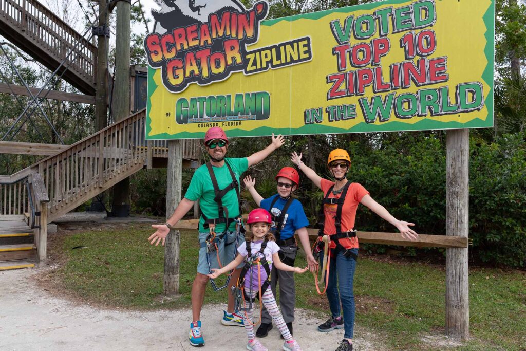 Family in zipline gear at Gatorland theme park