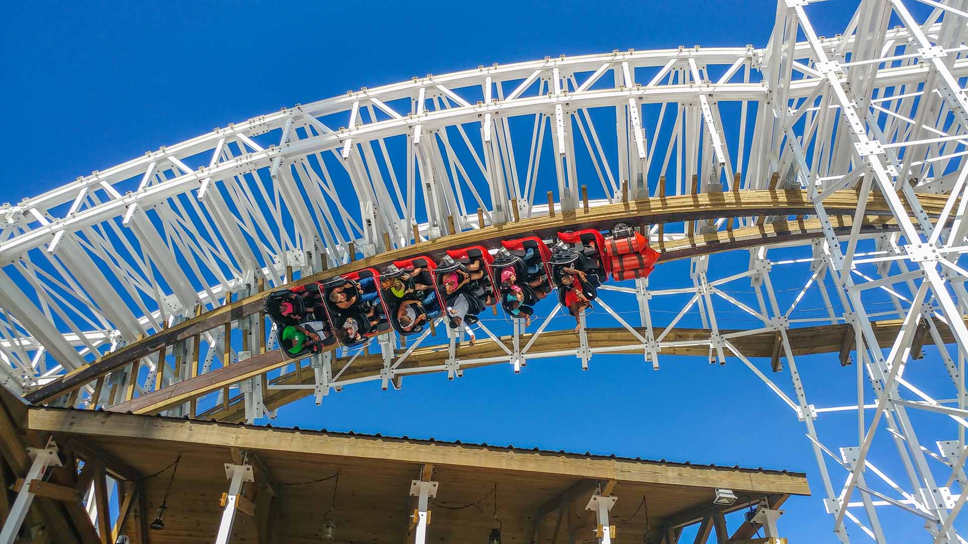 Group of people riding on the Mine Blower roller coaster in Fun Spot America in Kissimmee, Florida